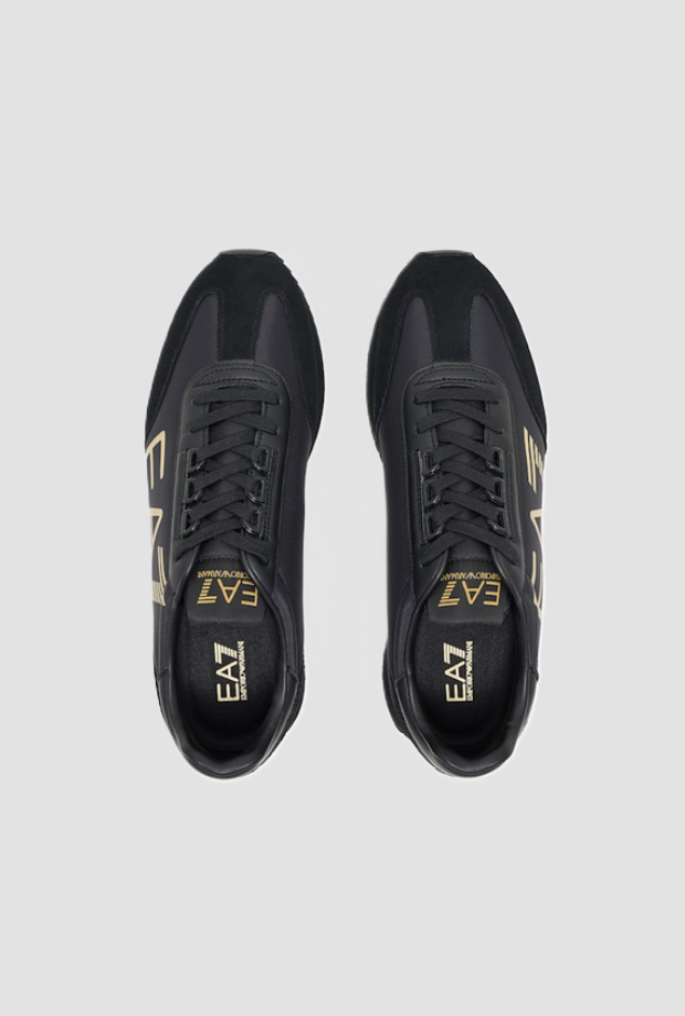 Scarpe con maxi logo in oro da uomo nero 